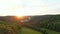 Aerial drone view of magic sunset over the Karlstejn castle, Czech republic. Famous castle is built on top of hill in the forest.