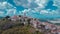 Aerial drone view of magnificent village of Motovun in Croatian Istria on a sunny day with cute fluffy clouds. Idyllic view of