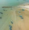 Aerial drone view of many fisherman boats by the coast in Tanjung Kempit, Mersing, Johor, Malaysia.