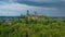 Aerial drone view medieval neo-gothic Braunfels castle on top of hill on gloomy rainy day. Hessen, Germany