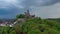 Aerial drone view medieval neo-gothic Braunfels castle on top of hill on gloomy rainy day. Hessen, Germany
