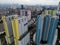 Aerial drone view of modern apartment building in Jakarta central business district with Jakarta cityscape and noise cloud.