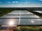 Aerial drone view of modern glass greenhouses