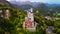 Aerial drone view Neuschwanstein castle on Alps background in vicinity of Munich, Bavaria, Germany, Europe. Autumn