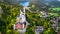 Aerial drone view Neuschwanstein castle on Alps background in vicinity of Munich, Bavaria, Germany, Europe. Autumn