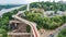 Aerial drone view of new pedestrian cycling park bridge construction, Dnieper river, hills, parks and Kyiv cityscape from above