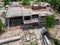 Aerial drone view of old demolished industrial building. Pile of concrete and brick rubbish, debris, rubble and waste of