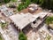 Aerial drone view of old demolished industrial building. Pile of concrete and brick rubbish, debris, rubble and waste of