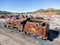 Aerial drone view of an old and rusty steam mining train used for transportation