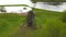 Aerial drone view of old vintage wooden windmill in spring summer time. Russian countryside.