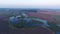 Aerial drone view over lake and fields