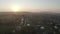 Aerial drone view over old village at sunrise. Thick fog covered all the fields