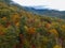 Aerial Drone view of overhead colorful fall / autumn leaf foliage near Asheville, North Carolina.Vibrant red, yellow, teal, orange