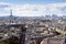 Aerial drone view of Paris in summer with Eiffel Tower, historical city center and La Defense financial district, France