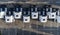 Aerial drone view of parked white trucks