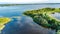 Aerial drone view of path on dam in polder water from above, landscape and nature of North Holland, Netherlands