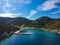 Aerial drone view of the picturesque old harbor Gerakas in northern Alonnisos, Greece. Scenery with rocky formation and natural