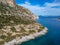 Aerial drone view of the picturesque old harbor Gerakas in northern Alonnisos, Greece. Scenery with rocky formation and natural