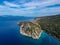 Aerial drone view of the picturesque old harbor Gerakas in northern Alonnisos, Greece. Scenery with rocky formation and natural