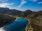 Aerial drone view of the picturesque old harbor Gerakas in northern Alonnisos, Greece. Scenery with rocky formation and natural