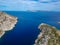 Aerial drone view of the picturesque old harbor Gerakas in northern Alonnisos, Greece. Scenery with rocky formation and natural