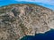 Aerial drone view of the picturesque old harbor Gerakas in northern Alonnisos, Greece. Scenery with rocky formation and natural