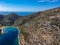 Aerial drone view of the picturesque old harbor Gerakas in northern Alonnisos, Greece. Scenery with rocky formation and natural