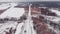 Aerial drone view of railroad tracks surrounded by countryside. Drone flying over forest with empty railroad