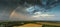 Aerial drone view of a rainbow over a field