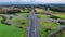 Aerial drone view road junction. Clover roundabout view from above. Car traffic on autobahn Germany