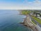 Aerial drone view on Salthill promenade, Galway, Ireland. Blue cloudy sky. Blackrock diving tower. Popular tourist area