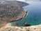 Aerial drone view of Shipwreck Olympia boat in Amorgos island during summer holidays, at the coastal rocky area, people on the