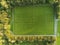 Aerial drone view on a small soccer pitch. Football training ground from above view