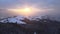 Aerial drone view of a snowy sunset in Carpathian Mountains in Ukraine