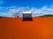 Aerial drone view , solar water heater boiler on rooftop, blue sky with white clouds