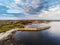 Aerial drone view on a Spiddal stone pier. County Galway, Ireland. Cloudy sky. Popular beach and walking spot and fishing location