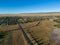 Aerial drone view of suburban Wyoming Intersection with residential buildings under blue sky