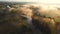 Aerial drone view of sunrise over misty river