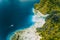 Aerial drone view of tropical Shimizu Island. Limestone coastal rocks, white sand beach in blue water. El Nido, Palawan