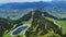 Aerial drone view turquoise lake in mountains Bavarian Alps. Ski resort in summer.
