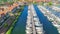 Aerial drone view of typical modern Dutch houses and marina in harbor, architecture of port of Volendam town, Holland, Netherlands