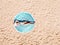 Aerial Drone View Of Woman In Swimsuit Bikini Relaxing And Sunbathing On Round Turquoise Beach Towel Near The Ocean