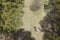 Aerial drone view of young woman with straw hat