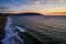 Aerial drone views at sunset over Bay area of San Francisco California at Houses and mansions extending out into the Coast