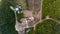 Aerial drop down view of olive farm houses with swimming pool.