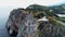 Aerial drove above view of swallow nest castle in Yalta, Crimea. Flying over rocky blue sea shore