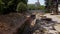 Aerial of dug trenches for pipelines and communications at a construction site. Water pipeline reconstruction and