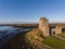 Aerial Dunguaire Castle Evening Sunset, near Kinvarra in County Galway, Ireland - Wild Atlantic Way Route. Famous irish castle.