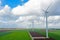 Aerial from a dutch landscape with windturbines, meadows and beautiful skies