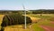 Aerial elevated drop down clip of rural wind turbines in the English countryside